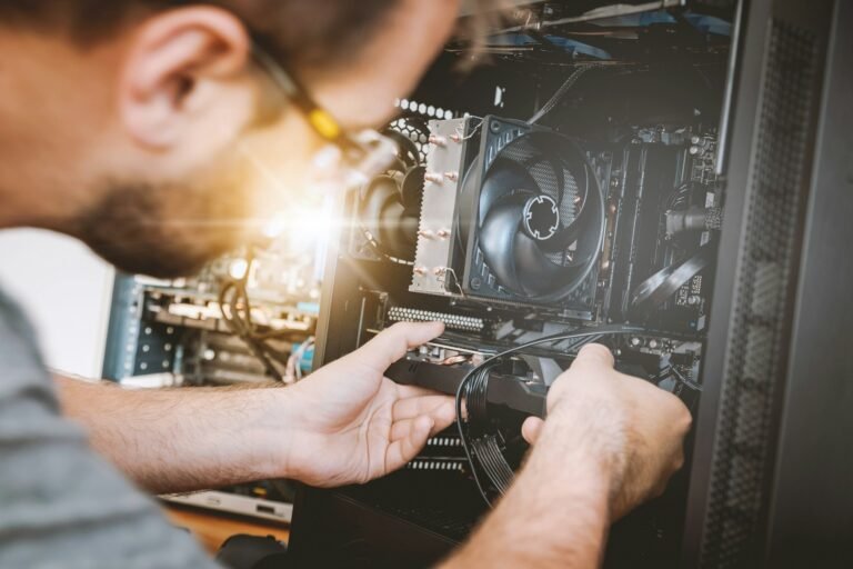 IT technician installing hardware while providing managed IT services for a small business