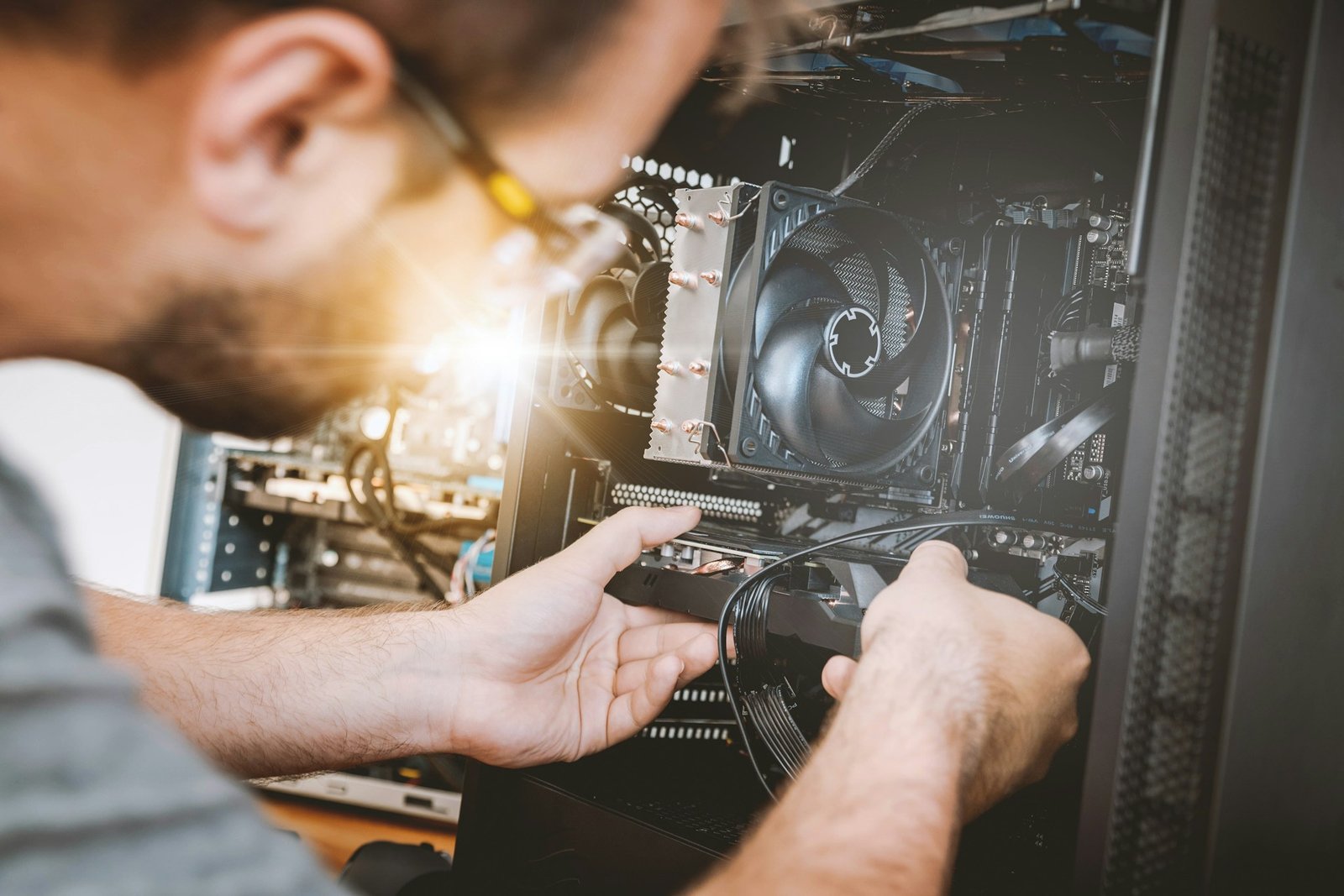 IT technician installing hardware while providing managed IT services for a small business